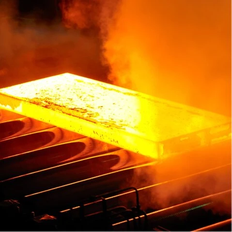 Engineer inspecting heat-treated alloy samples in a lab
