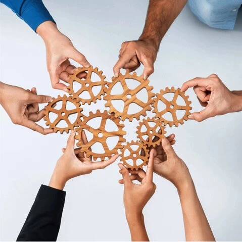 Technical workshop with engineers reviewing process data on screens